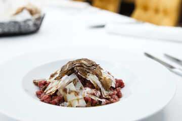 Veal tartare with truffle served on a plate