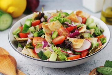 A bowl with Fattoush - Traditional Levantine salad	
