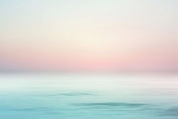 Obraz premium Serene pastel seascape at dawn with gentle waves and a tranquil sky reflecting soft colors