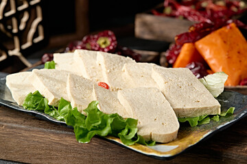 A plate of frozen tofu slices