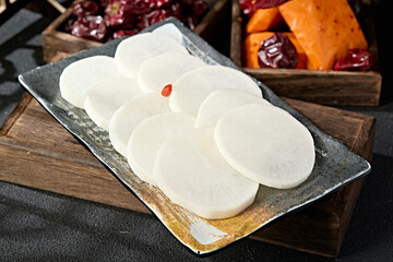 A plate of fresh white radish slices