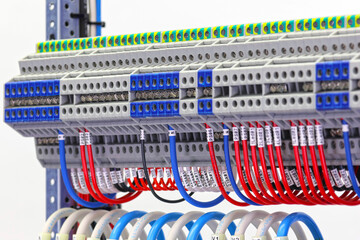 Electrical screw terminals for connecting wires in an electrical switchboard. Soft focus. Close-up.