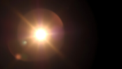 Obraz premium A naturalistic lens flare with golden sun rays peeking through, featuring soft halo effects and diffused edges on a dark gradient background.