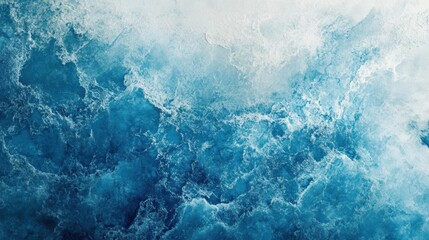 Obraz premium Aerial view of a churning ocean with white foam cresting over deep blue waves