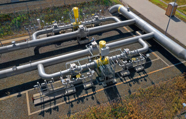 Natural gas pipeline in European Union. High pressure pipes on a hot summer day.	