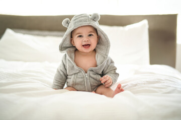 Portrait of a cute 6 months baby on a blanket