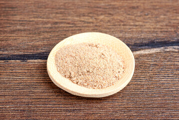 Close-up of spices, salt and dry broth for instant noodles on a wooden plate.