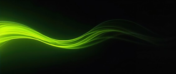 Flowing green and yellow neon light trails in darkness