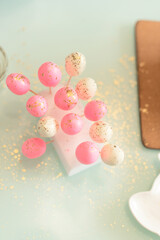 Small bright homemade Easter eggs are ready for decorating Easter cakes by it. Selective focus. Happy Easter concept. Process of cooking at home