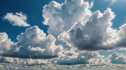 A bright and vibrant sunny sky filled with fluffy white clouds, showcasing a beautiful blue background