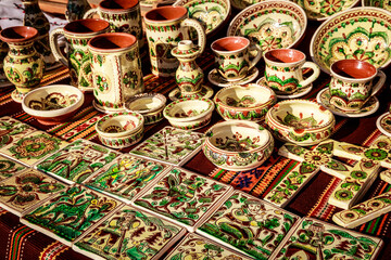 A table full of green and white ceramic items
