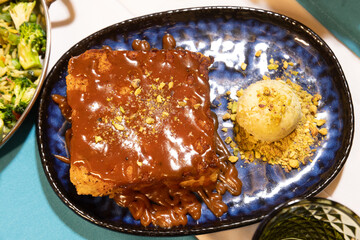 Chocolate-Drenched Pistachio Cake with Ice Cream

