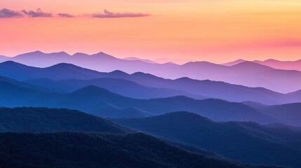 Obraz premium a mountain range with a sunset in the background