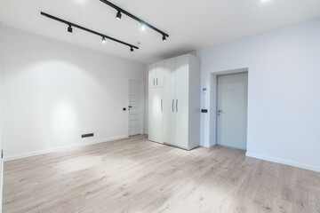 Modern Minimalistic Interior With Wood Flooring and Bright White Walls. AC on the Wall. Home Interior