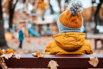 A person sitting on a bench in a park that was formerly their childhood playground, reminiscing while watching new generations play