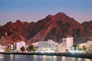 Panoramic view of Muscat Muttrah district with waterfront, traditional architecture in Oman during...