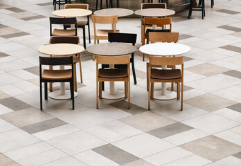 Empty tables and chairs in a cafe. Top view with copy space