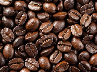 Obraz premium High quality close-up of roasted coffee beans with rich brown texture, isolated on white background. Perfect for coffee-related designs, branding and advertising.