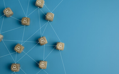 Wooden cube block with people icon and link connection network organization on pastel blue background, Coordination teamwork, Building strong organization.