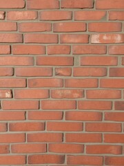 Rustic red brick wall background with rough texture and uneven surface, uneven, background, red