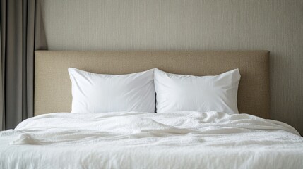 Obraz premium Stylish contemporary bedroom interior featuring a modern bed with white bedding and neutral color scheme for a serene atmosphere