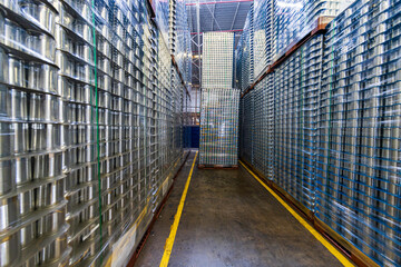 Industrial background of wet silver metal can after being cleaned from washing machine