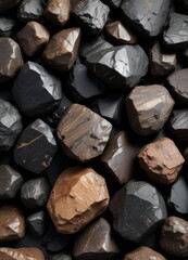 Geological Sample of Black and Dark Brown Obsidian Rocks, black obsidian samples, rocky terrain, dark brown rock samples