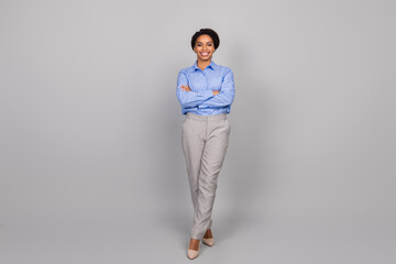 Full body photo of attractive young businesswoman crossed hands confident dressed stylish...