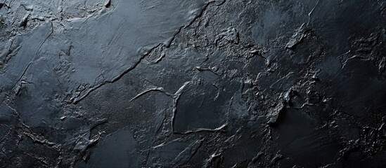 Fototapeta premium Grey and black textured abstract background with ample copy space for text or design elements