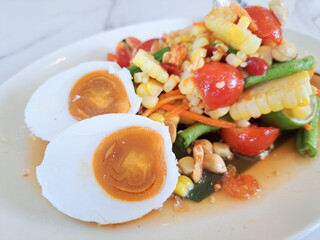 Salted egg salad is a type of Thai food that contains salted eggs. They are commonly sold in street markets in Thailand.