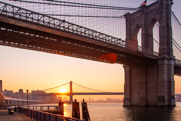 The city that Never Sleeps, New York in the USA, showcasing the iconic Brooklyn Bridge and the Manhattan Bridge at sunrise.