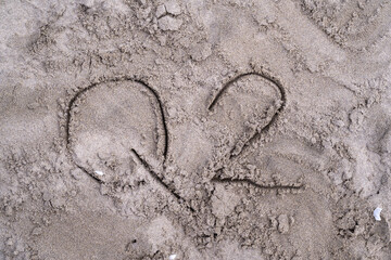 Ephemeral Whispers: A Sand Etching of Q2's Promise