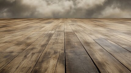 Natural wooden floor with dramatic cloudy sky background creating an atmospheric perspective for design or photography concepts.