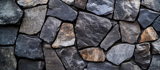 Fototapeta premium Black stone texture for home decoration with ceramic tile surface background featuring natural stone patterns and ample copyspace for text