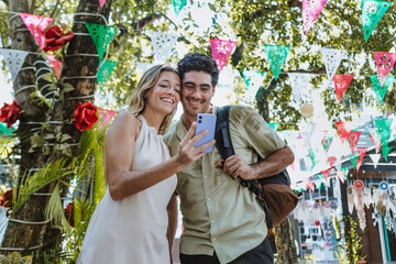 portrait of hispanic young couple on vacations or holidays and having fun in Mexico Latin America,...