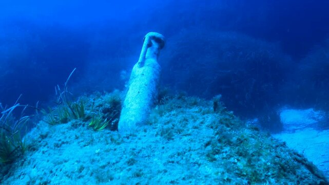 An amphora on a reef in the Mediterranean sea