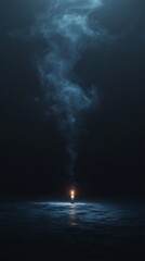 Obraz premium Lone candle flickers, casting light on a dark ocean