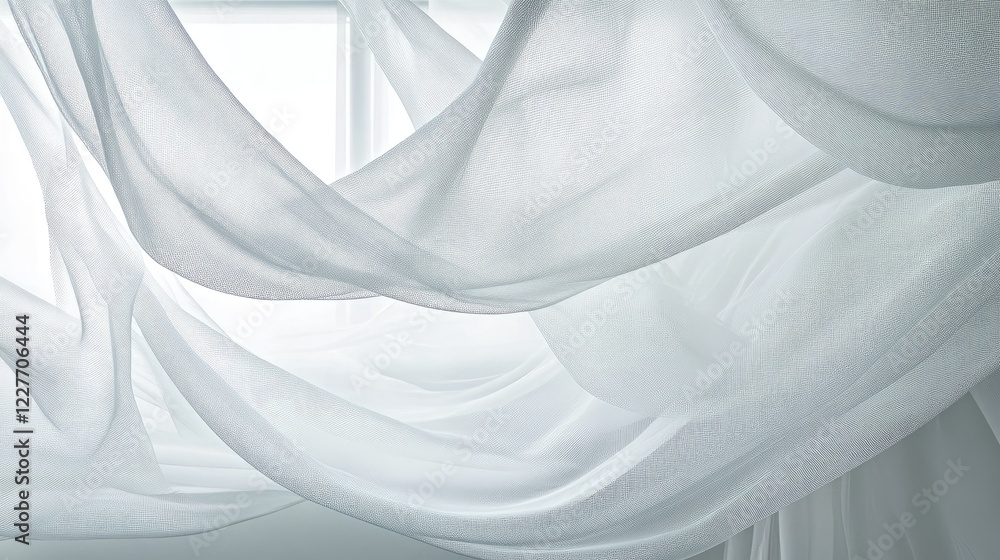 Poster delicate white nylon mosquito net draped in soft folds creating an airy atmosphere in a bright indoo