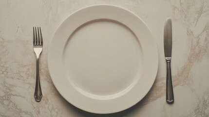 Empty dining plate with fork and knife on elegant table setting ready for restaurant menu or promotional text placement