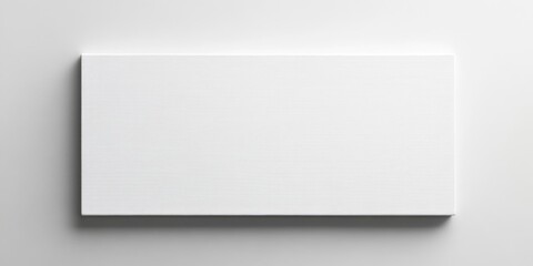 Obraz premium Blank white canvas in modern art gallery space ideal for showcasing artwork or adding personalized text and design elements.
