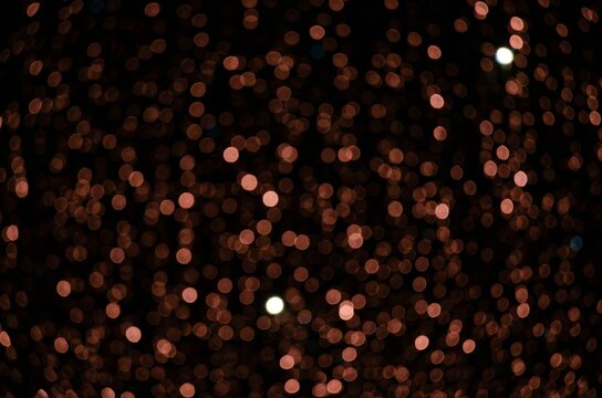 light pastel pink flashlights on a black background