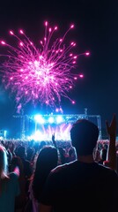 Colorful Fireworks Display at Night Over Concert Audience Celebration