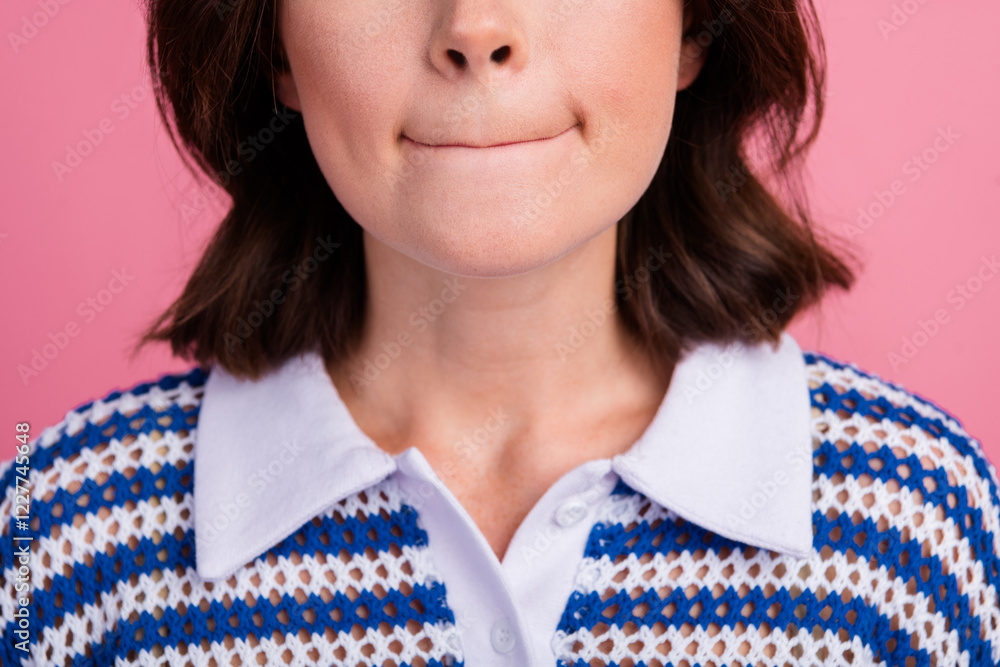 Wall mural Young brunette woman with trendy bob hairstyle and stylish t-shirt against pink background shows playful expression