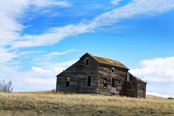 Derelict wooden house in the prairie in Alberta, Canada