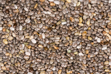 Raw chia seeds, fragment close-up in selective focus