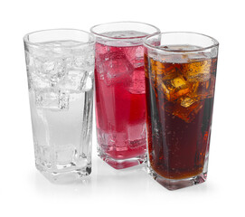 Soda water of different flavors with ice cubes in glasses isolated on white