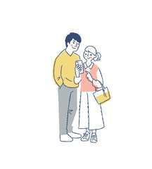 スマートフォンを見ている若いカップル