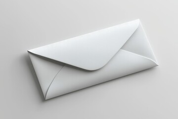 A closed white envelope resting on a smooth surface.