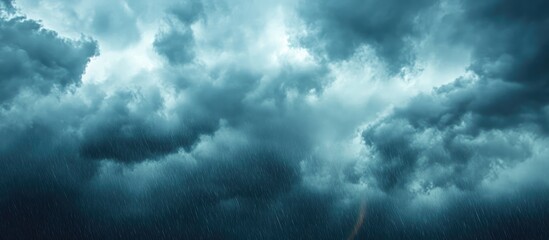 Obraz premium Dramatic overcast sky with dark rain clouds and a vibrant rainbow creating a serene backdrop with ample space for text overlay