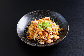 Japanese fried rice yakimeshi isolated in black background